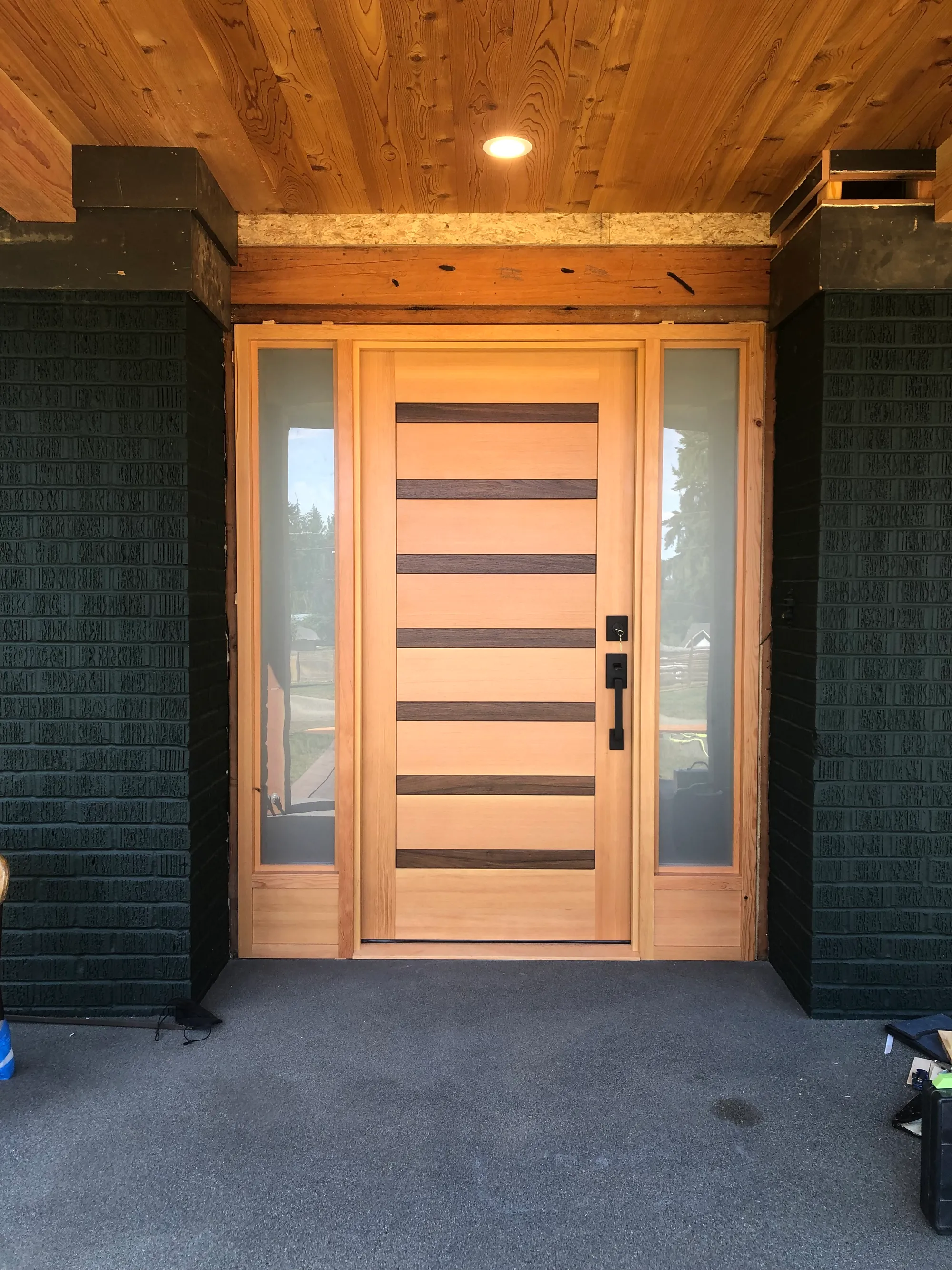 Entry way of Seattle home with custom door by Oxbow Fab