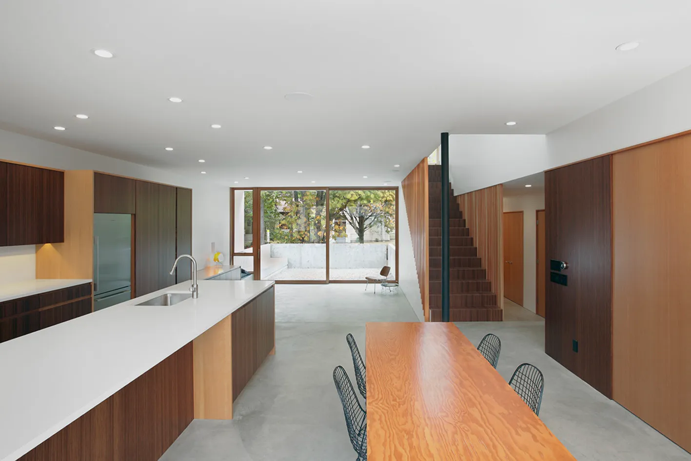 Architectural millwork installation showing casework, dining table, and architectural features