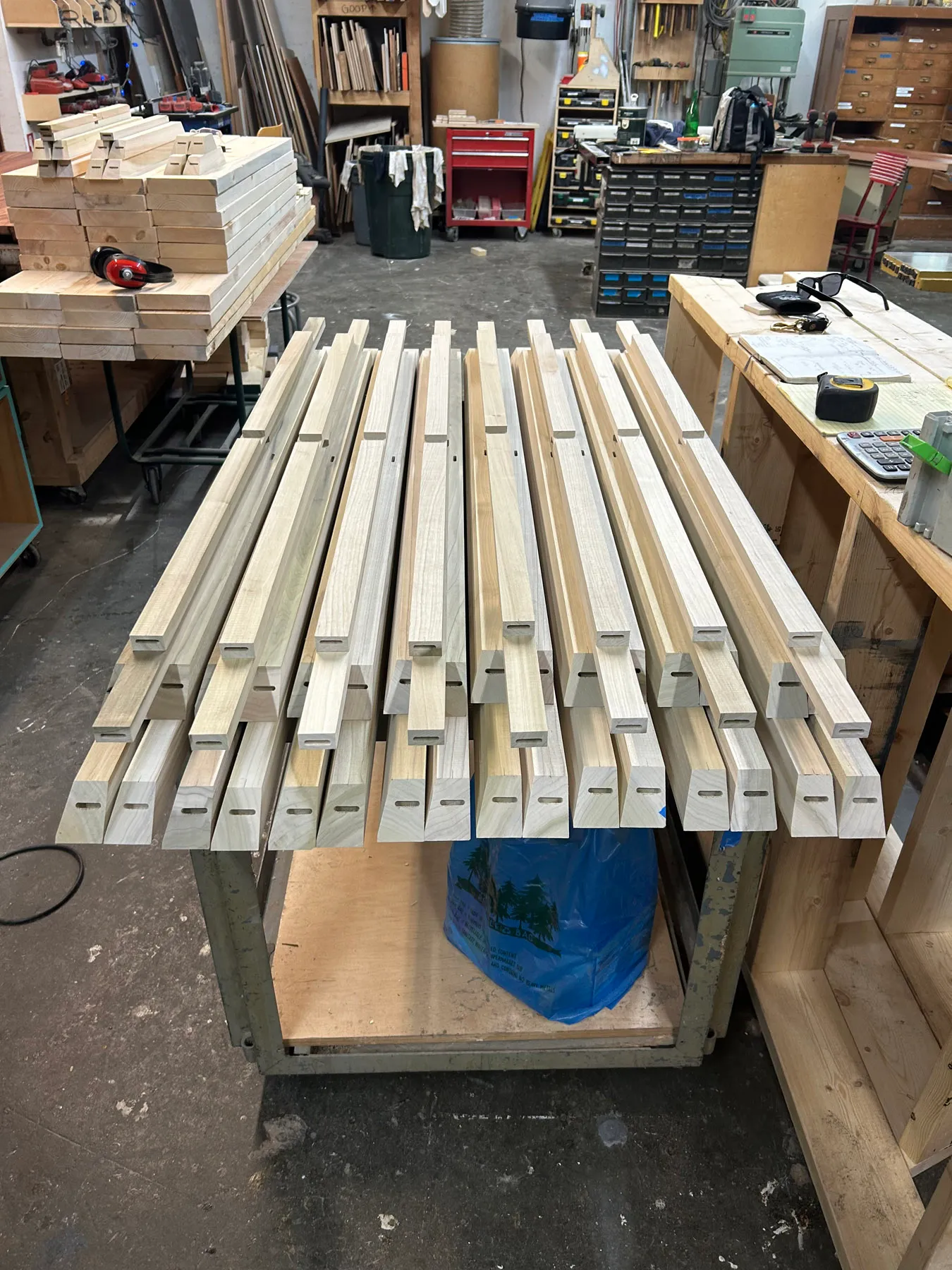 Frame shop workstation at Oxbow Fabrication showing cutting and assembly